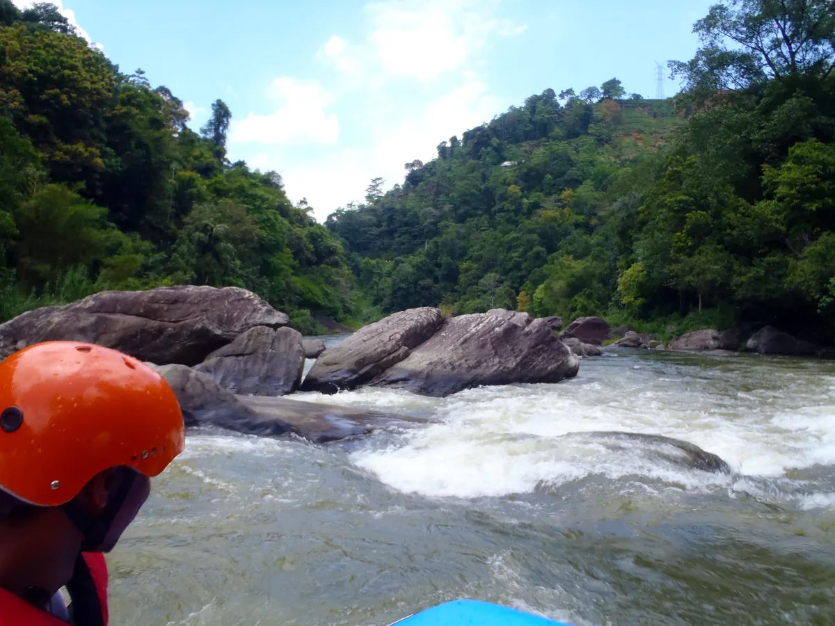 Rafters navigating the Kelani River in Kitulgala, Sri Lanka